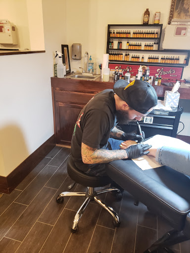 Explore leo sleeve tattoo ideas, creative tattoo ideas in Wheeling, available at Dark Horse Tattoo Studio
