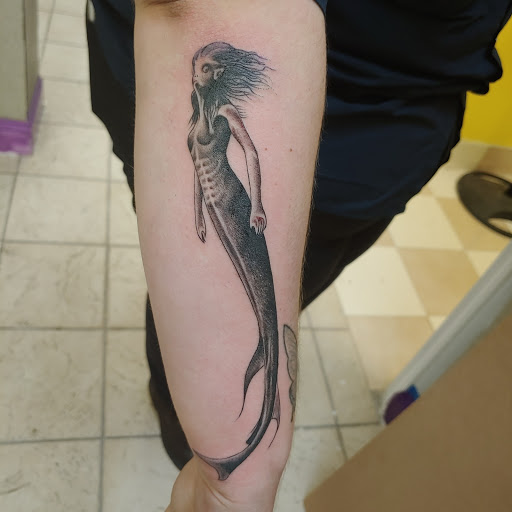 Explore tattoo ideas that symbolize strength, creative tattoo ideas in Verona, available at Cryptic Tattoo Society