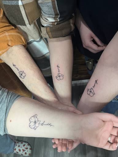 Explore back flower tattoo ideas, creative tattoo ideas in Marshfield, available at Out of the Blue Tattoo