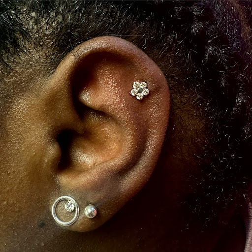 Explore world traveler tattoo ideas, creative tattoo ideas in Memphis, available at Rose Quartz Body Adornment LLC