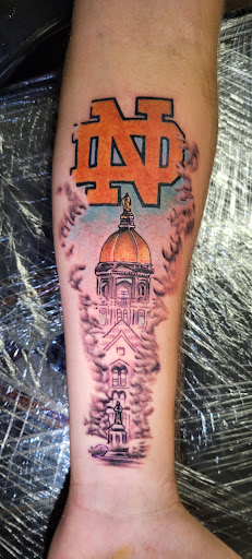 Explore barbed wire tattoo cover up ideas, creative tattoo ideas in Angola, available at Hoodlum Ink