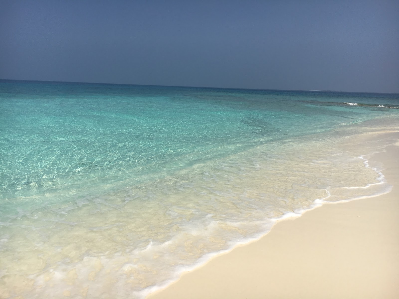 Photo of Maakurathu Island Beach with turquoise pure water surface