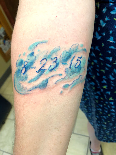 Explore women's arm tattoos ideas, creative tattoo ideas in Rockford, available at Delicious Ink Tattoo & Piercing