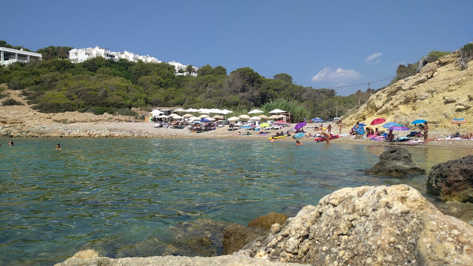 Photo of Cala Codolar with turquoise pure water surface