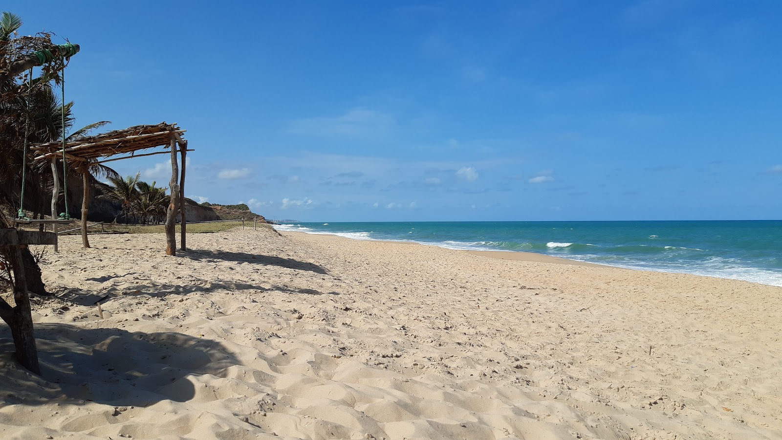 Fotografija Tambá plaža z svetel pesek površino