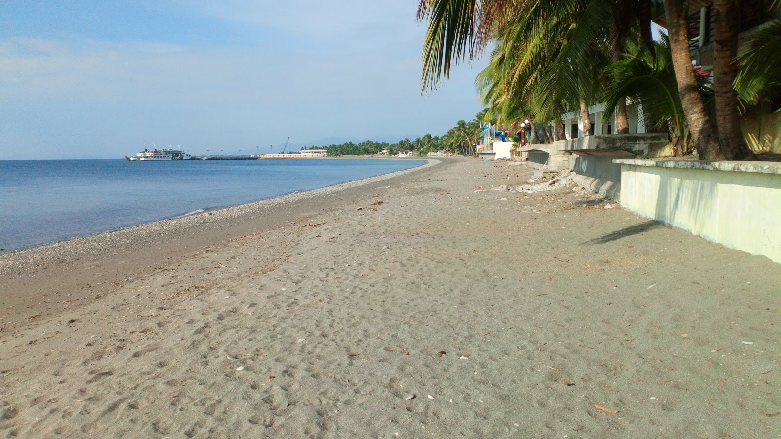 Photo of Nelia's Pandan Beach with gray sand surface