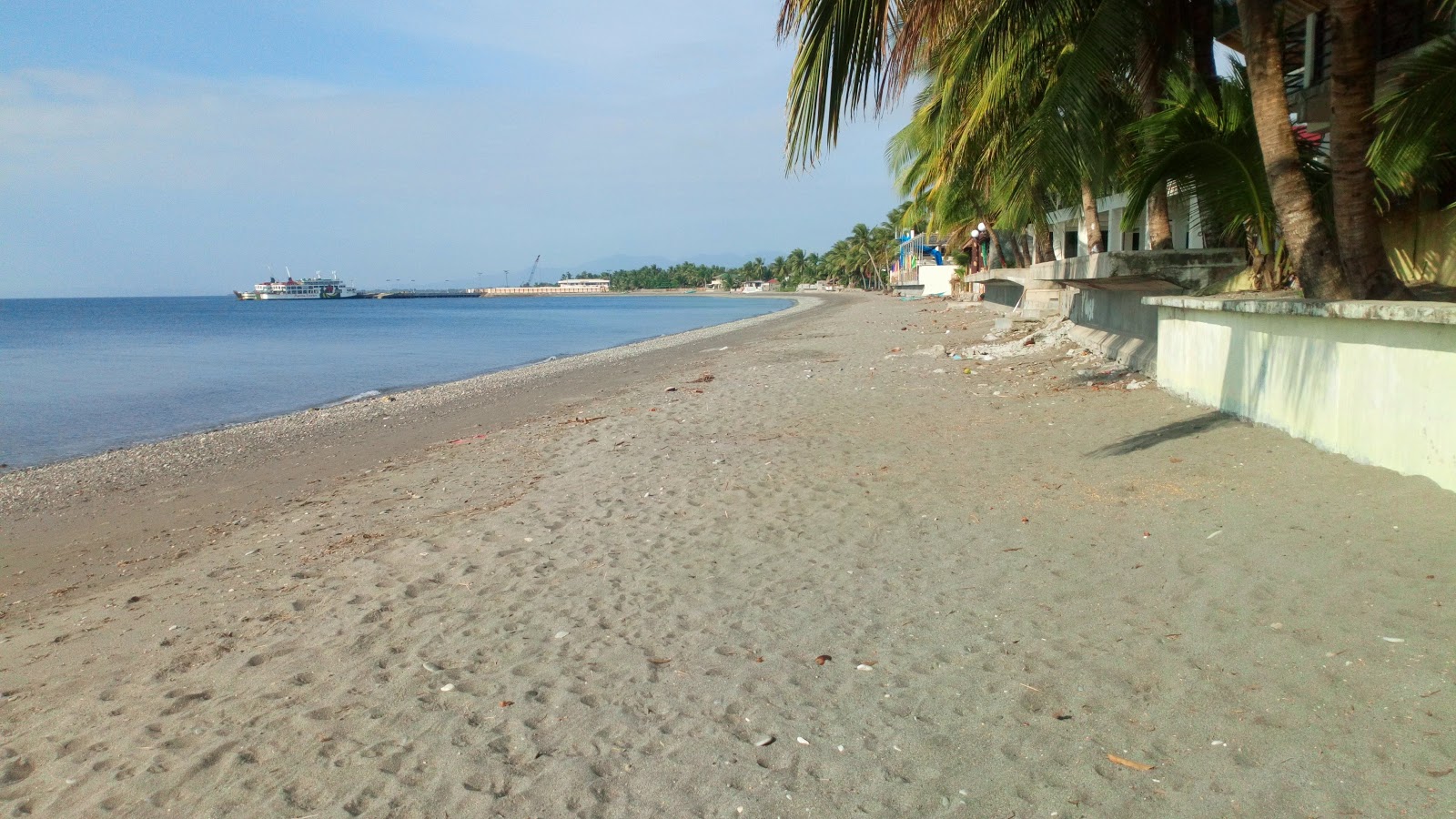 Foto von Nelia's Pandan Beach mit grauer sand Oberfläche