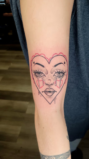 Explore wrap around wrist tattoo ideas, creative tattoo ideas in Toledo, available at HEYBABE Tattoo Studio