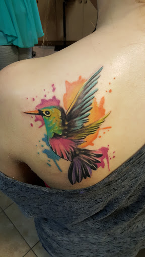 Explore fine line hand tattoo ideas, creative tattoo ideas in Wilson, available at New Addiction Tattoos