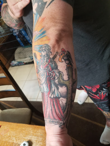 Explore red bird tattoo ideas, creative tattoo ideas in Sioux City, available at Addictive Tattoo-Piercing