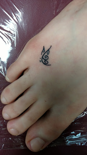 Explore women's leg tattoo ideas, creative tattoo ideas in Puyallup, available at Lindas Body Piercing