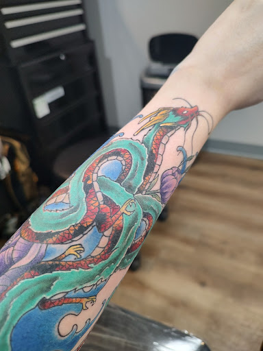 Explore koi fish tattoo ideas, creative tattoo ideas in Corning, available at Big Ink Tattoo & Piercing