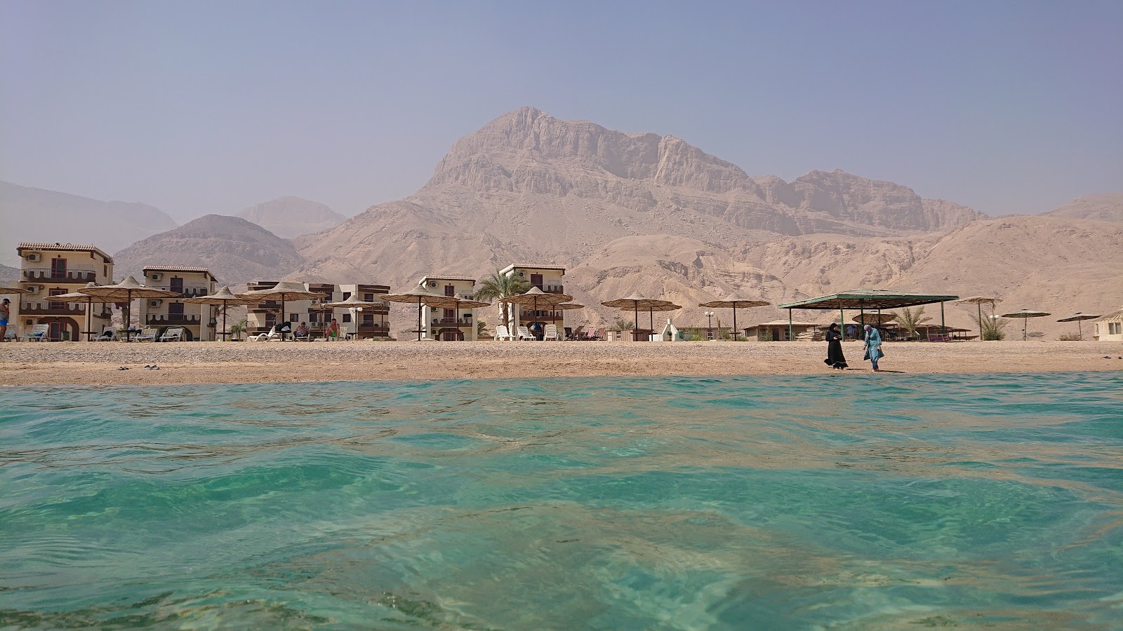 Photo of Dolphin Beach and the settlement