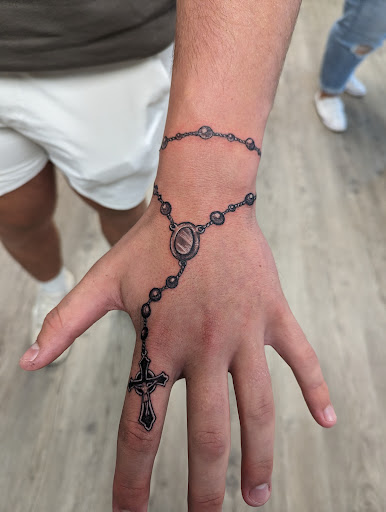 Find between the breast tattoo ideas for your next unique tattoo in Elkhart at Main Street Tattoos