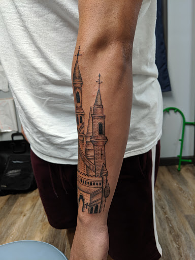 Explore small dinosaur tattoo ideas, creative tattoo ideas in Tewksbury, available at Lucid Arts Tattoo Studio