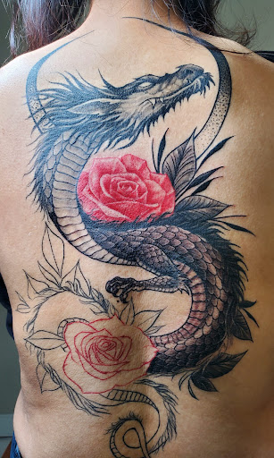 Explore lower back cover up tattoo ideas, creative tattoo ideas in Bowie, available at Studio 81 Tattoos