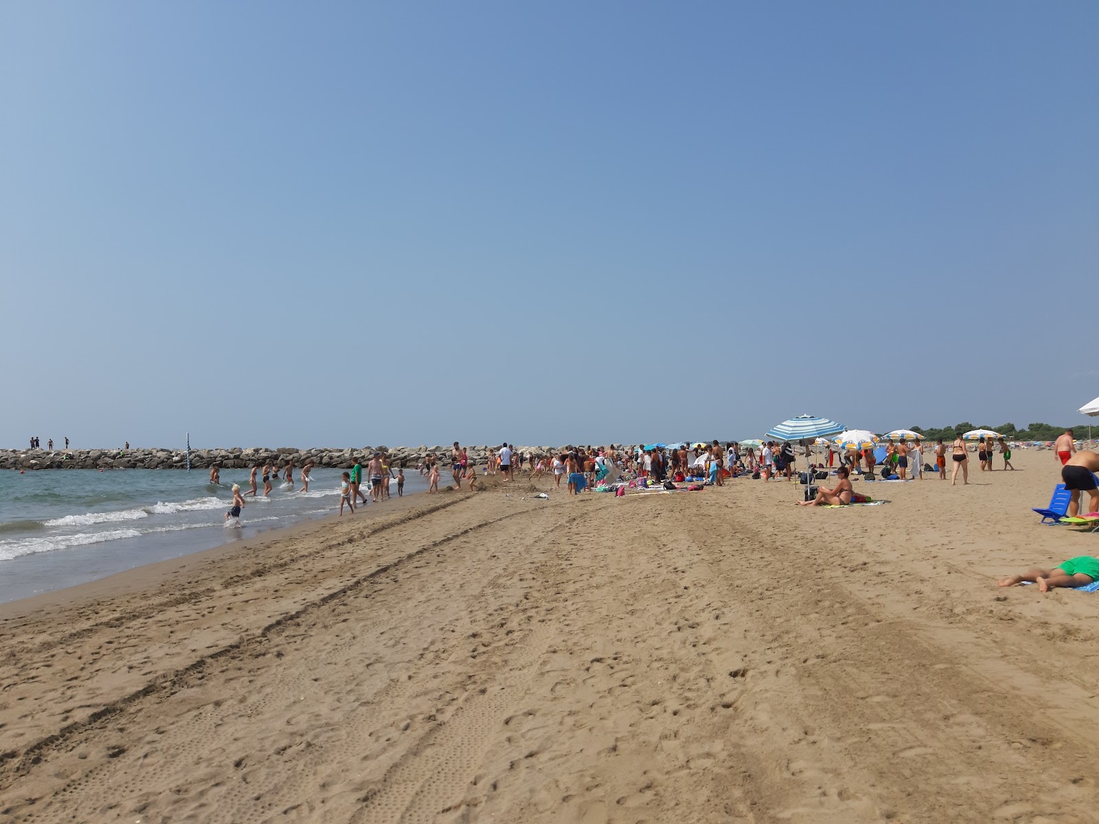 Foto av Spiaggia di Cavallino Treporti med lång rak strand