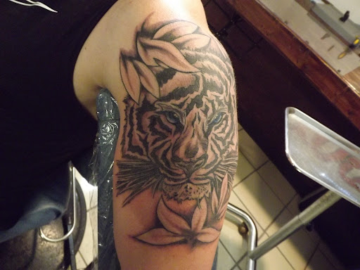 Explore purple flower tattoo ideas, creative tattoo ideas in Princeton, available at Custom Dreams Tattooing and Body Piercing