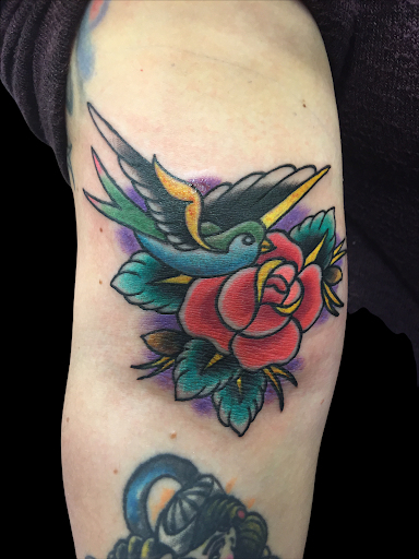 Explore afro tattoo ideas, creative tattoo ideas in Youngstown, available at BAREKNUCKLE TATTOO & BARBERSHOP