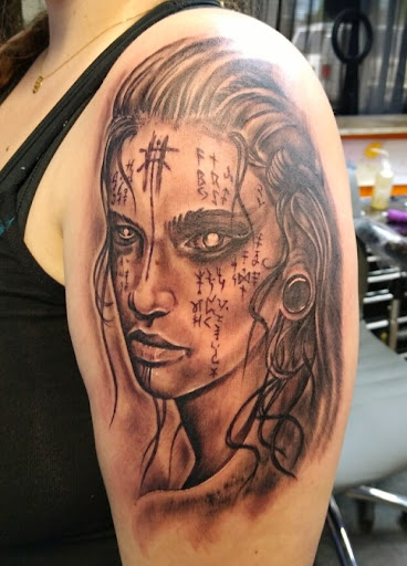 Explore ribbon tattoo ideas, creative tattoo ideas in Redding, available at DEADLIFT TATTOO