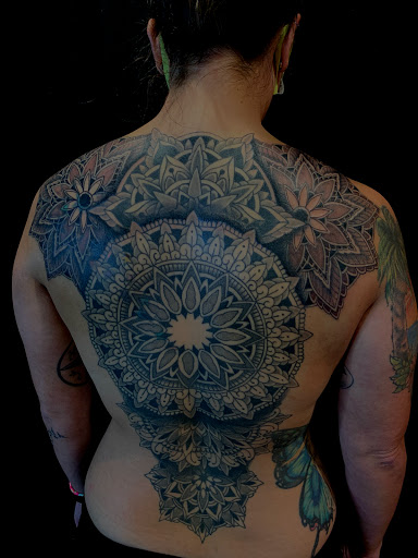 Explore mens back tattoo ideas, creative tattoo ideas in Mount Clemens, available at Hand & Heart Tattoo