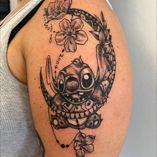 Explore aster flower tattoo ideas, creative tattoo ideas in Seymour, available at American Gypsy Tattoo Corp.