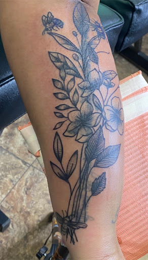 Explore flower tattoo ideas for guys, creative tattoo ideas in Fort Wayne, available at Grade A Tattoos and Body Piercing