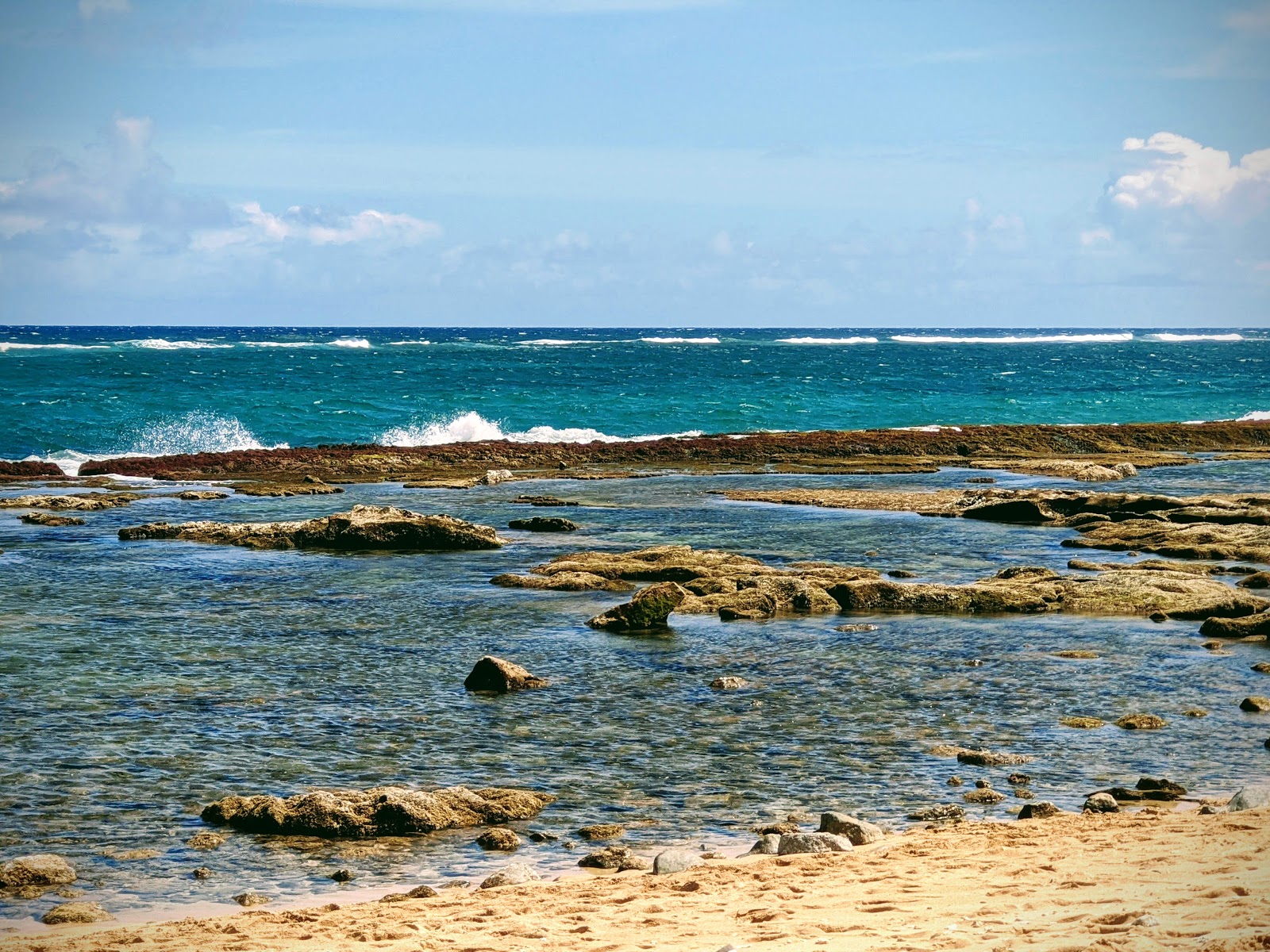Photo of Kuau Cove Beach and the settlement