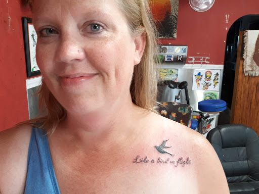 Explore women's cover up tattoo ideas, creative tattoo ideas in Bloomington, available at Iron & Ink Custom Tattoo And piercing.