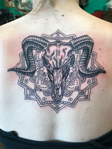 Explore tramp stamp tattoos ideas, creative tattoo ideas in Burlington, available at Vermont Custom Tattoo and Piercing