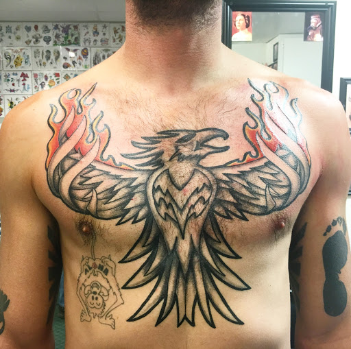 Explore female stomach tattoo ideas, creative tattoo ideas in Alamosa, available at The Shop Tattoo & Comics