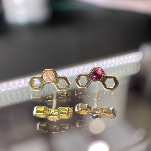 Explore atom tattoo ideas, creative tattoo ideas in Dover, available at Agap Body Piercings