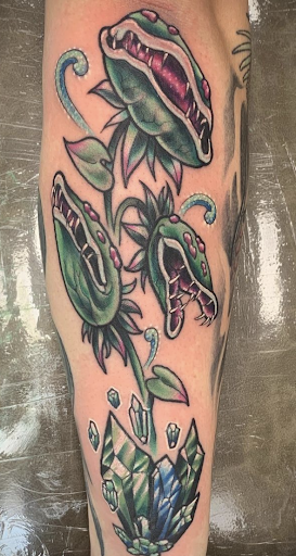 Explore shark tooth tattoo ideas, creative tattoo ideas in Pittsburgh, available at Human Canvas Tattoo & Piercing Pgh