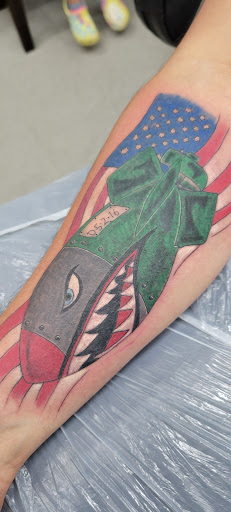 Explore western sleeve tattoo ideas, creative tattoo ideas in Jasper, available at Addictive Ink tattoo and piercing studio