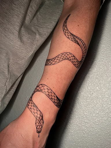 Explore mens tricep tattoo ideas, creative tattoo ideas in Rowlett, available at Ink Sirens Tattoo & Piercing Studio