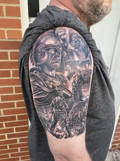 Explore barber tattoo ideas, creative tattoo ideas in Chapel Hill, available at Golden Falcon Tattoo and Piercing