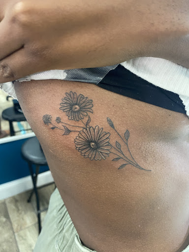 Explore live love laugh tattoo ideas, creative tattoo ideas in Buford, available at Wild Tribe Tattoos and Piercings