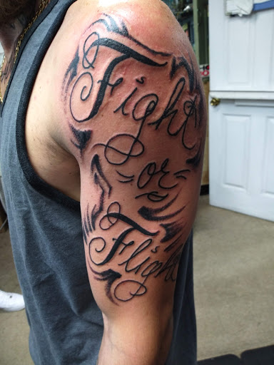 Explore bicep tattoo ideas for guys, creative tattoo ideas in Cranston, available at Kabloom Tattoo Studio