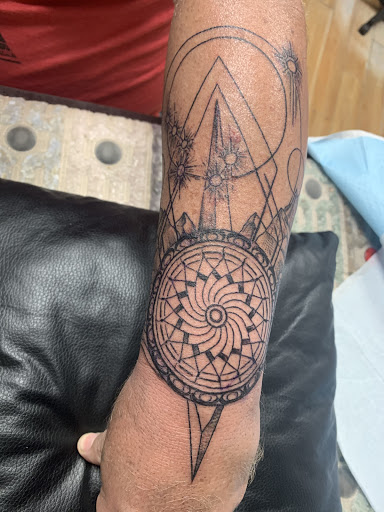 Explore dog outline tattoo ideas, creative tattoo ideas in Homer, available at Exotic Eye Tattoo