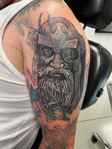 Explore hand tattoo ideas for man, creative tattoo ideas in Gadsden, available at House of Evans