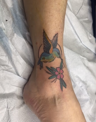 Explore leg flower tattoo ideas, creative tattoo ideas in Baltimore, available at Rippd Canvas Tattoo Shop Artists Social Club