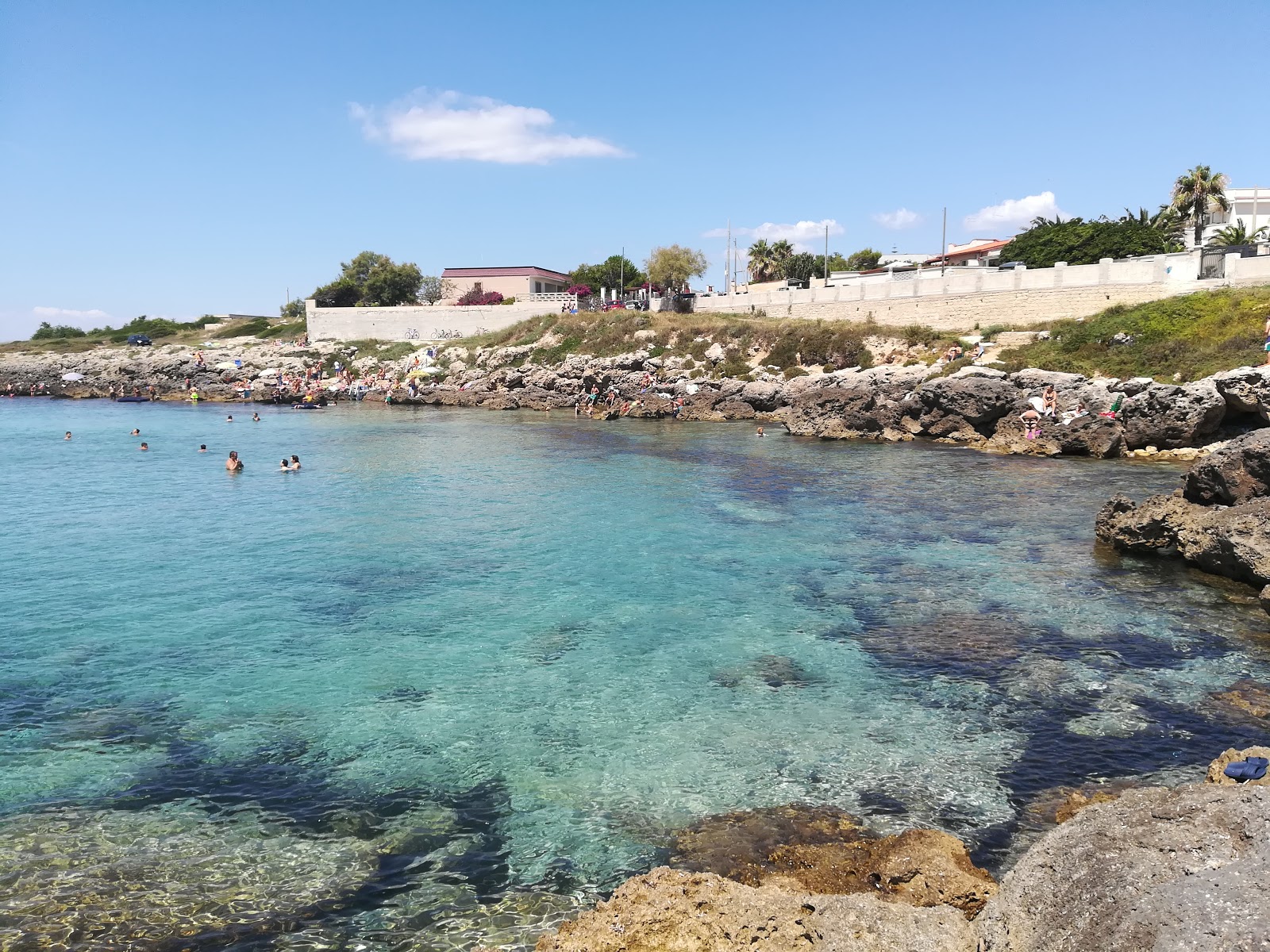 Foto von Spiaggia di Porto Franco mit felsiges gelände Oberfläche