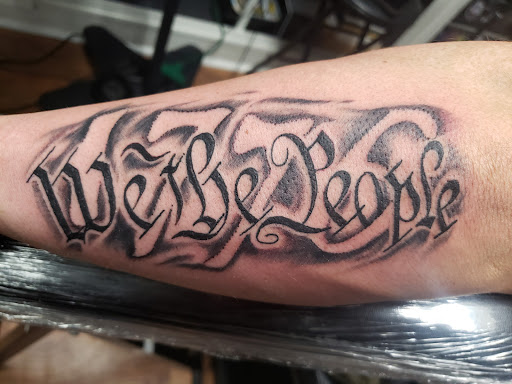 Explore tattoo ideas that symbolize strength, creative tattoo ideas in Orange, available at Smokin Irons Tattoo