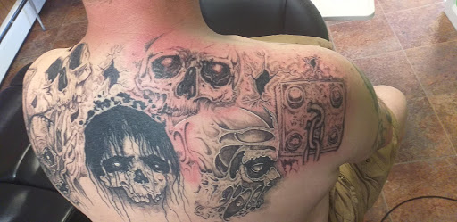Explore male side tattoo ideas, creative tattoo ideas in Calumet, available at Tattoos by Norm