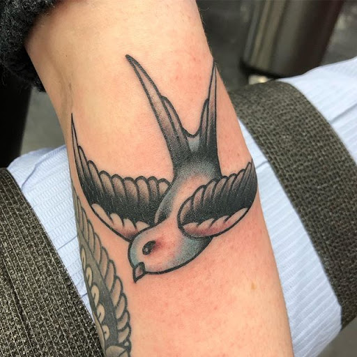 Explore red ink tattoo ideas, creative tattoo ideas in Snohomish, available at Unknown Tattoo Co.