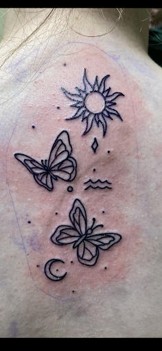 Explore tattoo ideas for roses, creative tattoo ideas in Bismarck, available at Alchemist Tattoo & Body Piercing