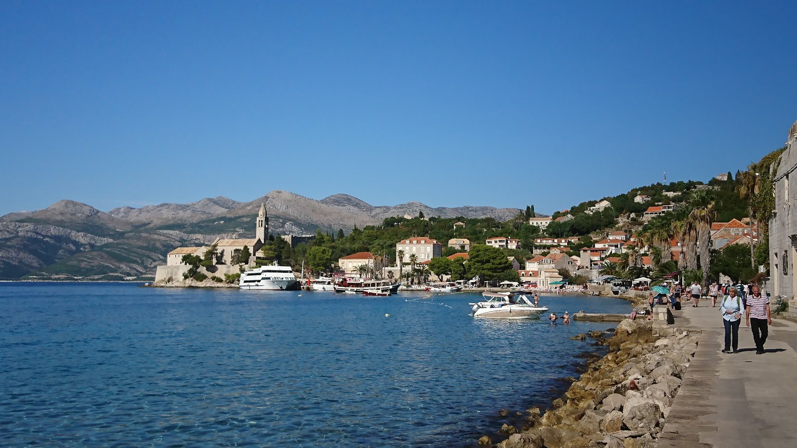 Photo of Otok Sipan with blue pure water surface