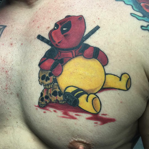 Explore kaws tattoo ideas, creative tattoo ideas in Albany, available at The Curly Wolf Tattoo Club