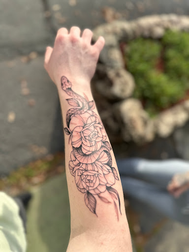 Explore red cardinal tattoo ideas, creative tattoo ideas in Redding, available at Dominant Ink