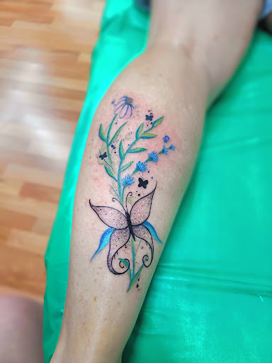 Explore tattoo cover up ideas on leg, creative tattoo ideas in Benton, available at Spectrum Tattoo